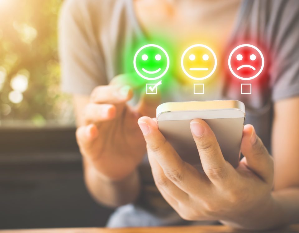 Customer Service Experience and Business Satisfaction Survey. Woman choose face smile on smart phone